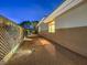 Well-maintained backyard features decorative lighting, gravel ground cover, and a tidy garden area at 30 Dry Brook Trl, Henderson, NV 89052