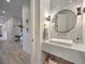 Modern powder room with a vessel sink, designer fixtures, and stylish mirror, enhancing the overall aesthetic of the home at 30 Dry Brook Trl, Henderson, NV 89052