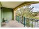 View of a cozy green balcony with wrought-iron seating and railing, offering a peaceful outdoor retreat at 30 Strada Di Villaggio # 143, Henderson, NV 89011