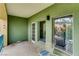 A spacious green balcony with outdoor seating and railing, providing scenic views and a serene setting at 30 Strada Di Villaggio # 143, Henderson, NV 89011