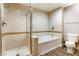 Bathroom featuring a tub shower combo with tile surround at 30 Strada Di Villaggio # 143, Henderson, NV 89011