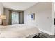 Relaxing bedroom with hardwood floors and a large window at 30 Strada Di Villaggio # 143, Henderson, NV 89011