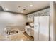 Efficient kitchen with stainless steel sink, granite countertops, and modern white appliances at 30 Strada Di Villaggio # 143, Henderson, NV 89011