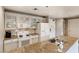 Well-lit kitchen featuring modern appliances and granite countertops at 30 Strada Di Villaggio # 143, Henderson, NV 89011