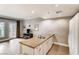 Modern kitchen featuring granite countertops, stainless steel appliances, and seamless flow into the living area at 30 Strada Di Villaggio # 143, Henderson, NV 89011