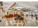 Luxurious building lobby featuring tile flooring, seating, and concierge desks under elegant lighting at 30 Strada Di Villaggio # 143, Henderson, NV 89011