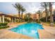 Beautiful outdoor pool surrounded by palm trees and resort-style amenities, perfect for relaxation and recreation at 30 Strada Di Villaggio # 143, Henderson, NV 89011