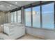 Bright bathroom with white cabinets, dual sinks, and frosted windows at 322 Karen Ave # 201, Las Vegas, NV 89109
