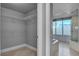 Bathroom with dual access to walk-in closet, tub, and walk-in shower at 322 Karen Ave # 201, Las Vegas, NV 89109