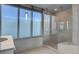 Bathroom featuring a glass shower and views of The Stratosphere at 322 Karen Ave # 201, Las Vegas, NV 89109