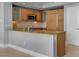 Modern kitchen with stainless steel appliances, granite counters, and light wood cabinetry at 322 Karen Ave # 201, Las Vegas, NV 89109