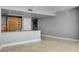Living area featuring travertine floors and a modern kitchen area at 322 Karen Ave # 201, Las Vegas, NV 89109