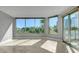 A bright living room with expansive windows and a sliding glass door with a great view at 322 Karen Ave # 201, Las Vegas, NV 89109