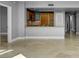 Bright living room with travertine floors, a modern kitchen, and great lighting at 322 Karen Ave # 201, Las Vegas, NV 89109