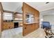 Cozy kitchen with light wood cabinets, black appliances, and a breakfast bar to the dining area at 343 W Basic Rd, Henderson, NV 89015