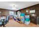 Spacious living room featuring ample storage and wood-paneled walls at 343 W Basic Rd, Henderson, NV 89015