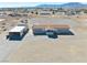 Expansive aerial view of property showing home, shed, and surrounding desert landscape at 3581 W Dyer Rd, Pahrump, NV 89048