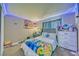 Well-lit bedroom with colorful decor and ample storage space at 3581 W Dyer Rd, Pahrump, NV 89048