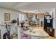 Well-lit kitchen with wood cabinets, functional layout, and a breakfast bar for casual dining at 3581 W Dyer Rd, Pahrump, NV 89048