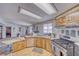 Functional kitchen featuring light wood cabinets, updated appliances, and lots of counter space at 3581 W Dyer Rd, Pahrump, NV 89048