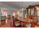 Dining and living area featuring shiny wood floors and modern furniture at 4068 Pistachio Nut Ave, Las Vegas, NV 89115