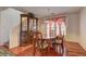Dining room featuring shiny wood floors and natural light from a window at 4068 Pistachio Nut Ave, Las Vegas, NV 89115