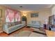 Cozy living room with comfortable seating, good lighting, and colorful accents at 4068 Pistachio Nut Ave, Las Vegas, NV 89115