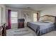 Comfortable main bedroom featuring a king-sized bed, a dresser, and natural light, creating a relaxing retreat at 4068 Pistachio Nut Ave, Las Vegas, NV 89115