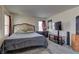 Inviting main bedroom with a king bed, desk, and dresser, designed for rest and productivity at 4068 Pistachio Nut Ave, Las Vegas, NV 89115