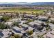 Gorgeous aerial view of a golf course community with lush greenery, luxury homes, and a serene atmosphere at 420 Pinnacle Heights Ln, Las Vegas, NV 89144