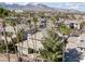 Picturesque aerial showcasing homes with palm trees and mountain views creating an inviting neighborhood at 420 Pinnacle Heights Ln, Las Vegas, NV 89144