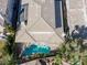 Overhead view of a private backyard with a sparkling pool, lush landscaping, and elegant patio area at 420 Pinnacle Heights Ln, Las Vegas, NV 89144