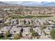 Golf course community aerial view showcasing a lush green golf course, mature landscaping, and mountain views at 420 Pinnacle Heights Ln, Las Vegas, NV 89144