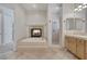 Relaxing bathroom featuring a fireplace, jetted tub, tiled surround, and shower at 420 Pinnacle Heights Ln, Las Vegas, NV 89144