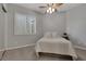 Bright bedroom featuring plush carpeting, shutters, and neutral decor at 420 Pinnacle Heights Ln, Las Vegas, NV 89144