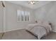 Comfortable bedroom with plush carpeting, shutters, and neutral decor at 420 Pinnacle Heights Ln, Las Vegas, NV 89144