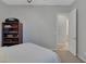 Guest bedroom with plush carpeting and access to bathroom at 420 Pinnacle Heights Ln, Las Vegas, NV 89144
