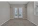 Bedroom features double French doors with shutters and neutral carpeting, providing natural light at 420 Pinnacle Heights Ln, Las Vegas, NV 89144