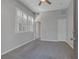 Bright bedroom with neutral carpet, plantation shutters, and multiple doors for easy access at 420 Pinnacle Heights Ln, Las Vegas, NV 89144