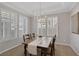 Inviting dining room with large windows offering ample natural light and neutral decor at 420 Pinnacle Heights Ln, Las Vegas, NV 89144