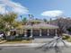 Charming home with a three-car garage, well-maintained landscaping, and a welcoming entrance at 420 Pinnacle Heights Ln, Las Vegas, NV 89144