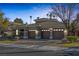 Attractive home featuring a three-car garage and manicured landscaping at 420 Pinnacle Heights Ln, Las Vegas, NV 89144