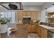 Eat-in kitchen featuring light wood cabinets, granite countertops and gas cooktop at 420 Pinnacle Heights Ln, Las Vegas, NV 89144