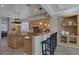 Spacious eat-in kitchen featuring light wood cabinets and granite countertops at 420 Pinnacle Heights Ln, Las Vegas, NV 89144