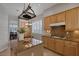 Eat-in kitchen featuring light wood cabinets, granite countertops and gas cooktop at 420 Pinnacle Heights Ln, Las Vegas, NV 89144