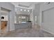 Open-concept living space with tile flooring, access to the backyard, and neutral tones at 420 Pinnacle Heights Ln, Las Vegas, NV 89144