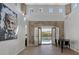 Bright living room with high ceilings, tiled floors, and views of the pool at 420 Pinnacle Heights Ln, Las Vegas, NV 89144