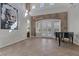 Spacious living area with stone accent wall, piano, and plenty of natural light at 420 Pinnacle Heights Ln, Las Vegas, NV 89144
