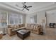 Bright living room features a comfortable sofa, elegant decor, and large windows at 420 Pinnacle Heights Ln, Las Vegas, NV 89144