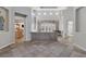 Bright and airy living space with views into kitchen, neutral paint and tile floors at 420 Pinnacle Heights Ln, Las Vegas, NV 89144